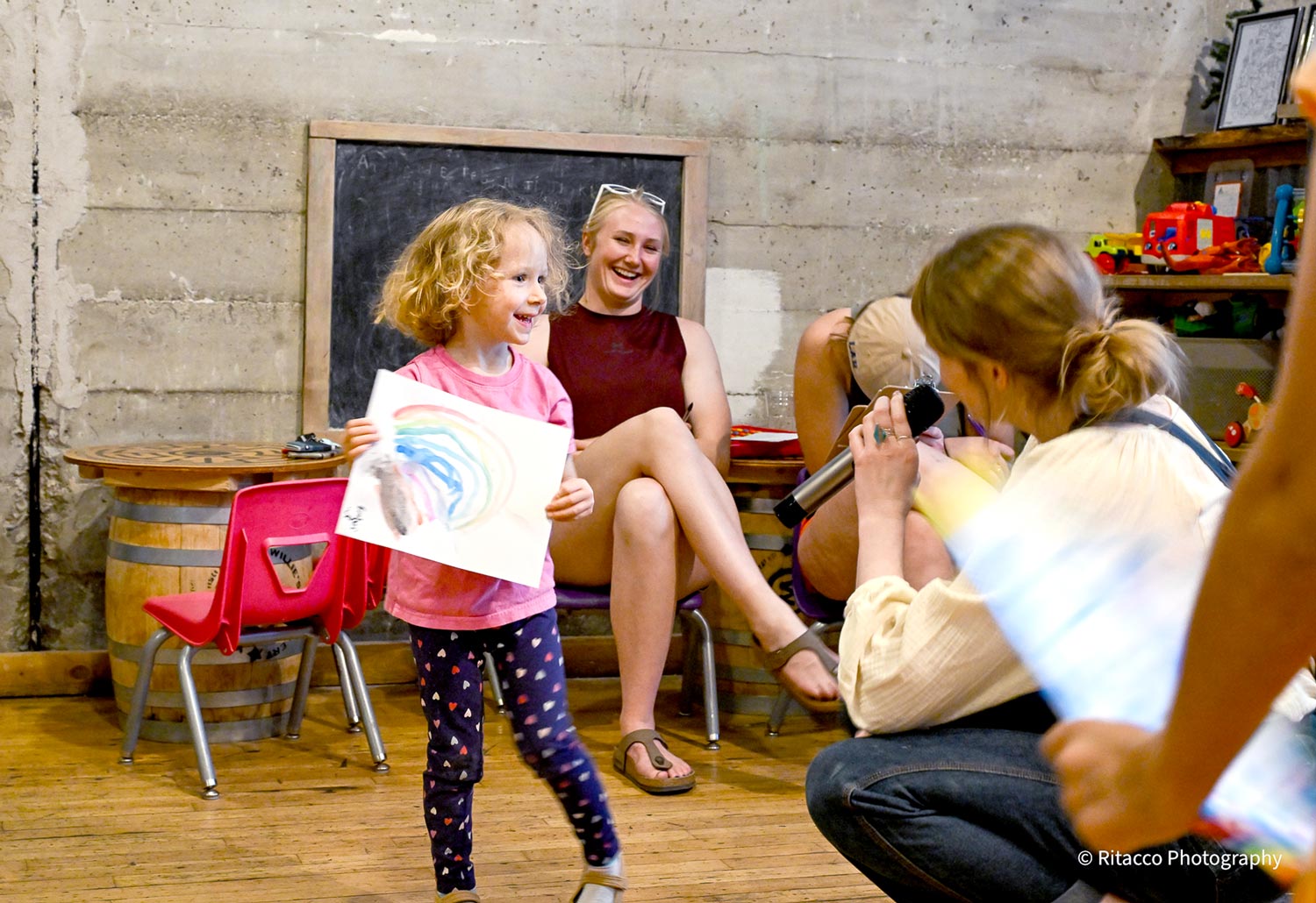 katya talking to little girl Katya talking to little girl with a color drawing